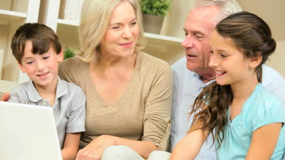stock-footage-caucasian-grandchildren-joining-their-grandparents-using-a-laptop